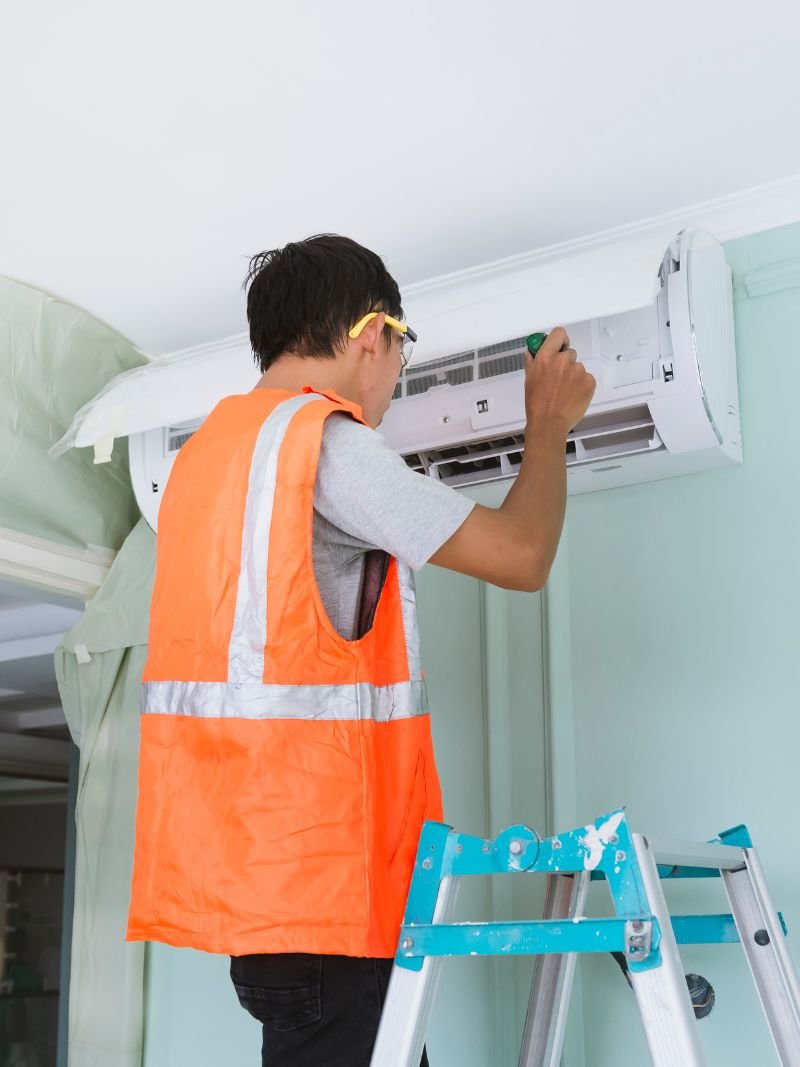 Aircon technician at work